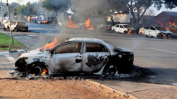 South Africa reverses asylum directive after protests leave vehicles burnt and shops looted